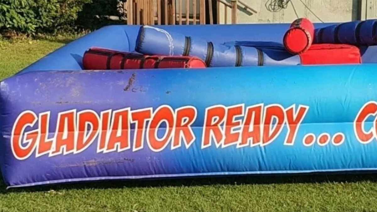 inflatable gladiator hire london